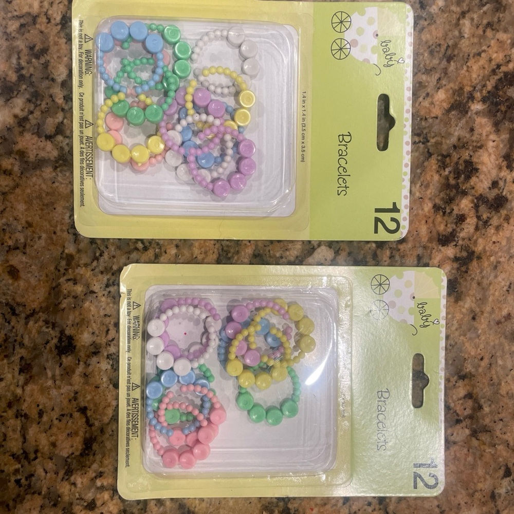 Two packages of baby shower bracelet decor